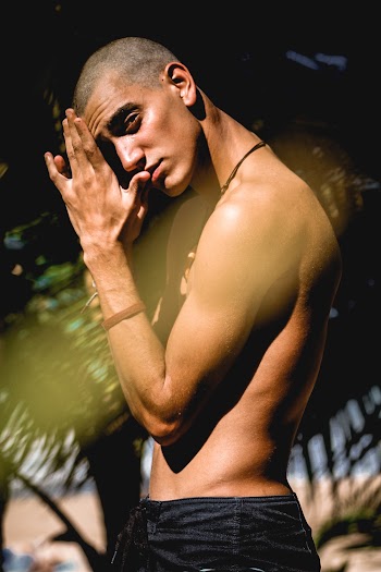 Side View Photo of Shirtless Man Posing
