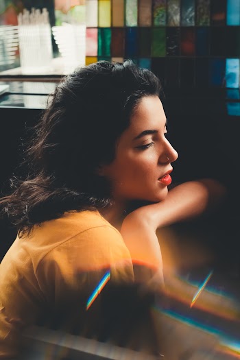 Side View Photo of Sitted Woman