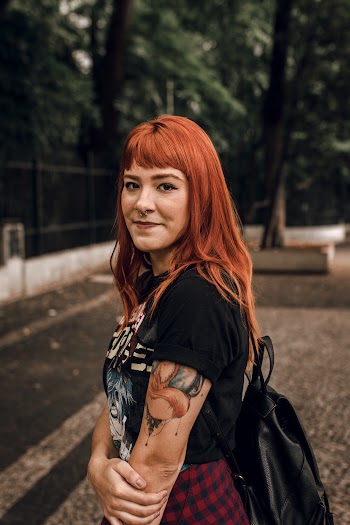 Side View Photo of Smiling Woman