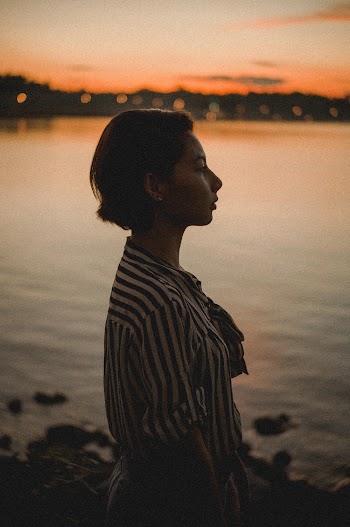 Side View Photo Of Woman During Dawn