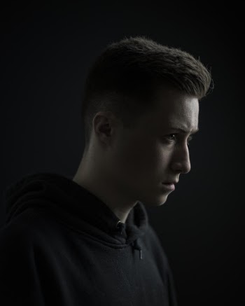 Side View Portrait Photo of Man in Black Hoodie
