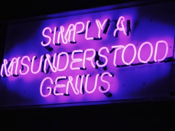 Sign in a hotel in Bournemouth. Simply a misunderstood genius. It made me smile and also mention to my husband that the sign was definitely there for him.  It makes me feel happy and laugh at the humour of the sign.  