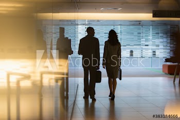 Silhouette business people walking in lobby