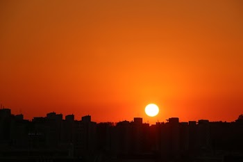 Silhouette Cityscape Against Romantic Sky at Sunset