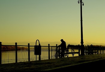 Silhouette Man on Street in City at Sunset