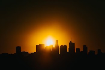 silhouette of a buildings during sunset