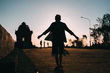 Silhouette of a Person During Dawn
