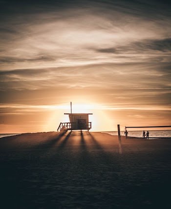 silhouette of brown lifeguard