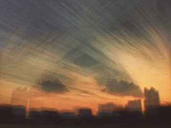 Silhouette Of Buildings Under Dramatic Sky