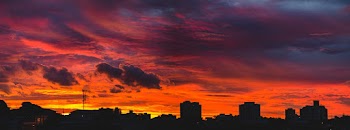 Silhouette Of Buildings Under Orange and Gray Sky