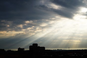 Silhouette of Buildings Under Sun Rays