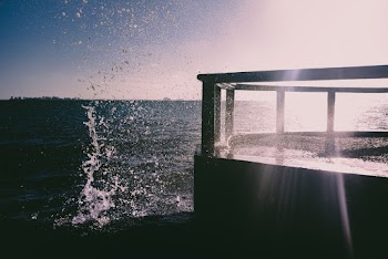 Silhouette of Dock Near Body of Water