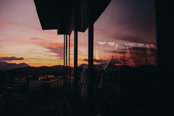 Silhouette of Glass House during Golden Hour