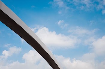silhouette of gray concrete arch