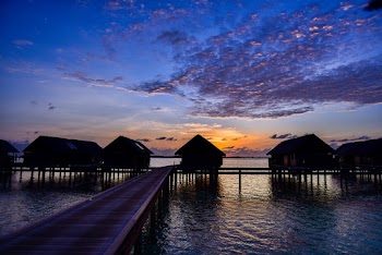 Silhouette of House Near Dock