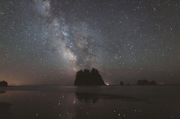silhouette of island during night time