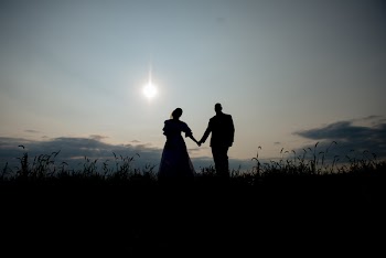 Silhouette of Man and Woman Holding Hands