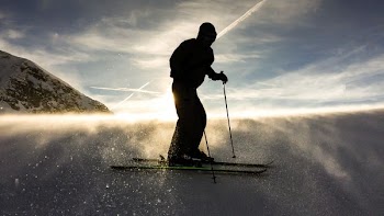 silhouette of man doing ski