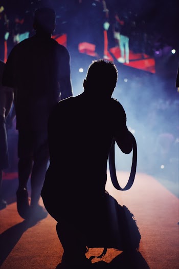 Silhouette of Man Kneeling on Floor