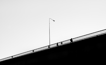 Silhouette of Man Near Railing