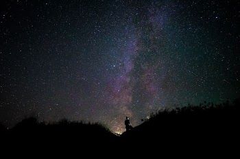 silhouette of man on mountain during nighttime