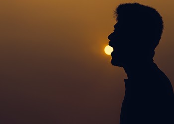 Silhouette of Man over the Horizon