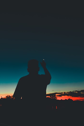 Silhouette Of Man Pointing Moon