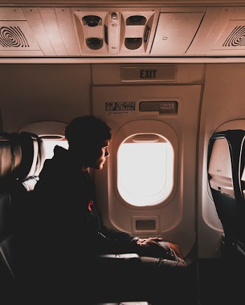 Silhouette Of Man Sitting Inside Airplane
