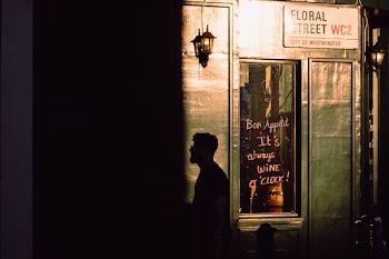 silhouette of man standing near door