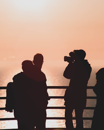 Silhouette Of Man Using Camera