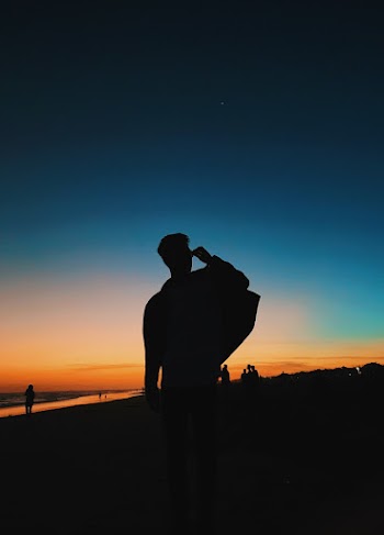 Silhouette of Man Wearing Backpack