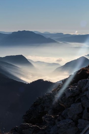 silhouette of mountain during sunny day