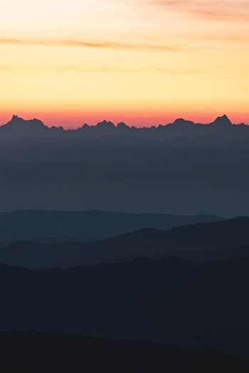silhouette of mountain during sunse