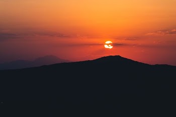 silhouette of mountain during sunset