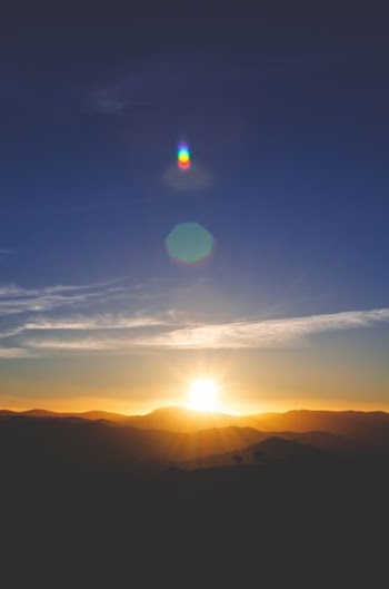 silhouette of mountain during sunset