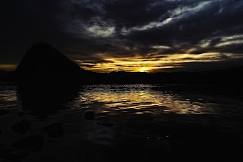 Silhouette Of Mountain Near Lake