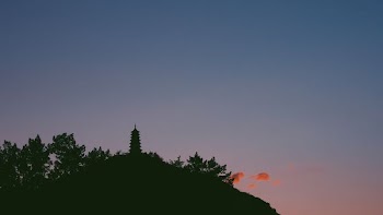 silhouette of mountain with building