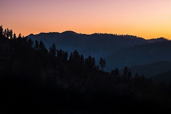 silhouette of mountains under clear sky