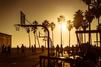 Silhouette Of People At A Basketball Court