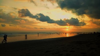Silhouette of People At The Beach
