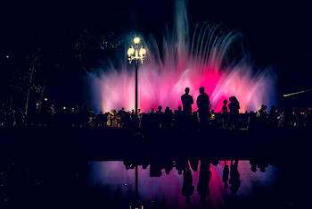Silhouette Of People Near Fountain