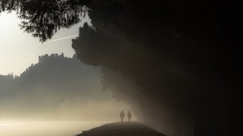 Silhouette of People on Cliff