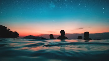 Silhouette of People on Water during Dusk