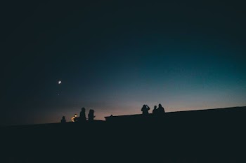 silhouette of people under clear sky