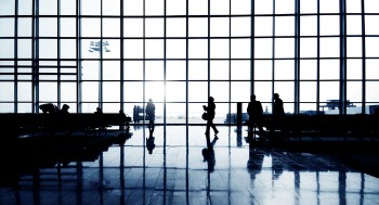 Silhouette of People Walking Inside Building