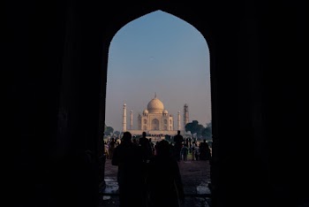 Silhouette of People Walking Towards Taj Mahal