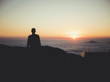 Silhouette of Person during Dawn