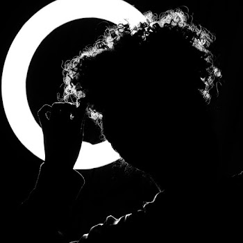 Silhouette of Person Facing Ring Light