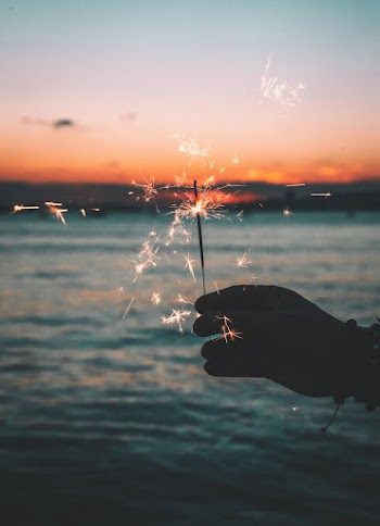 Silhouette of Person Holding Fireworks