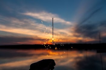 silhouette of person holding sparker